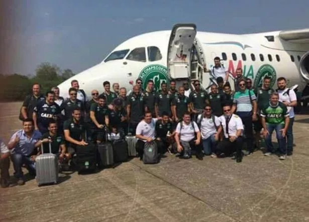 The-Brazilian-football-team-posing-together-in-front-of-a-passenger-jet.jpg